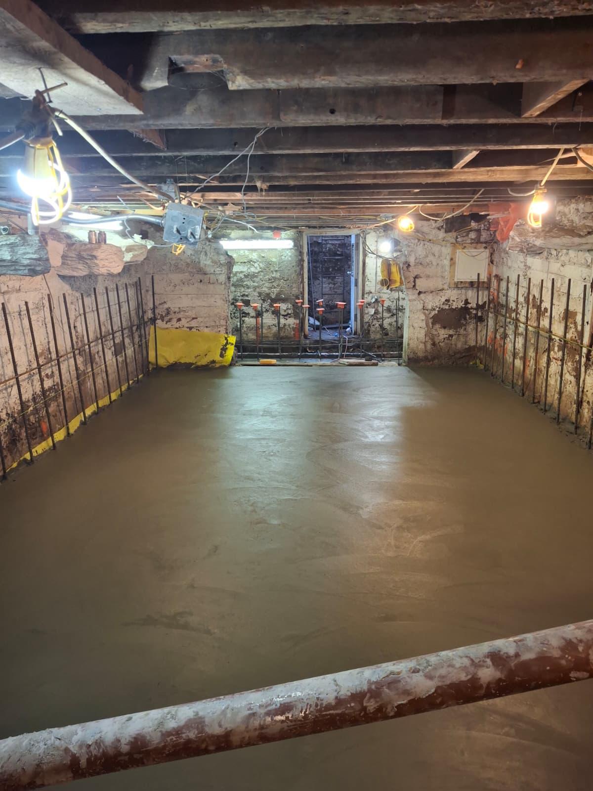 Concrete basement floor pour with rebar in New York City