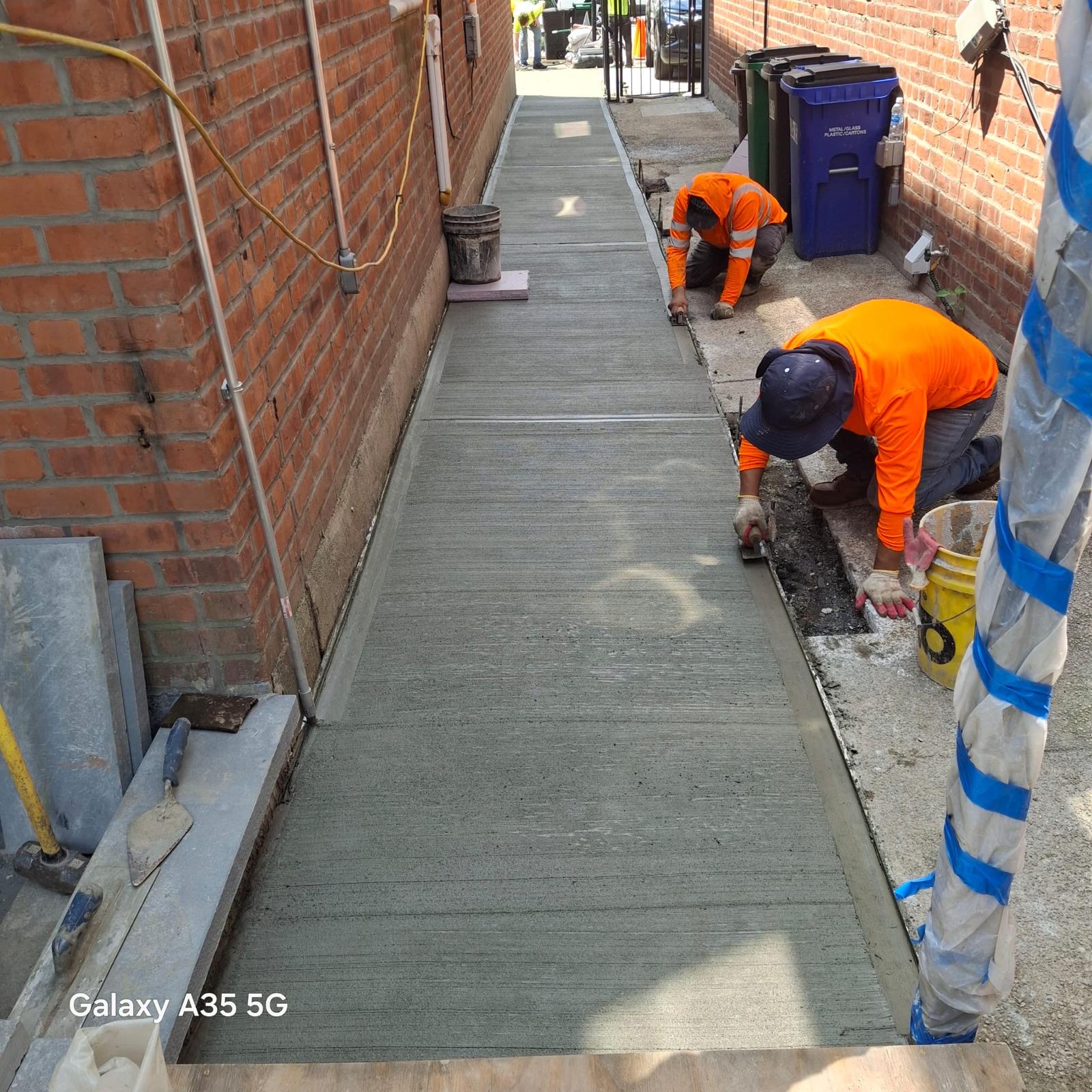 DOT sidewalk violation repair in progress in New York City
