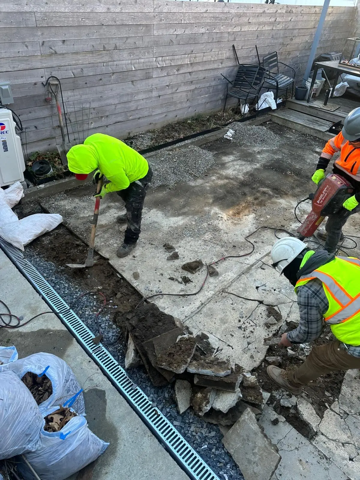 Concrete patio pour preparation in a NYC backyard
